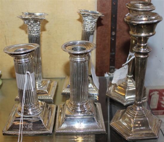 Two pairs of silver Corinthian column candlesticks & another pair (faults & a.f)